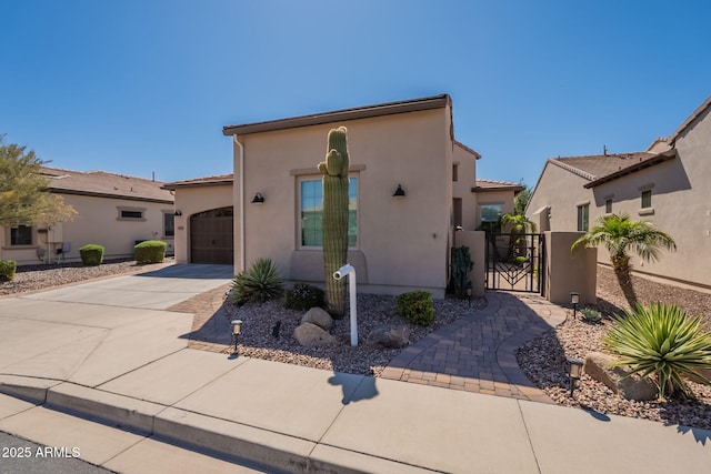 35756 N Clementine Trl, San Tan Valley, AZ 85140 - view of front of house featuring a gate, a tile roof, driveway, an attached garage, and stucco siding