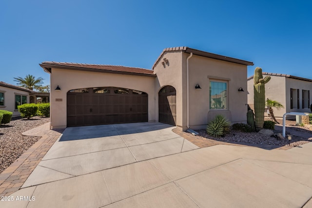 35756 N Clementine Trl, San Tan Valley, AZ 85140 - mediterranean / spanish house featuring an attached garage, a tiled roof, stucco siding, and driveway