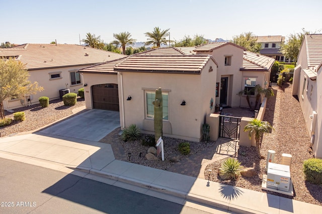 35756 N Clementine Trl, San Tan Valley, AZ 85140 - mediterranean / spanish home featuring a garage, concrete driveway, and stucco siding