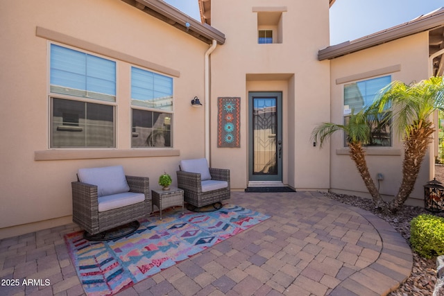 35756 N Clementine Trl, San Tan Valley, AZ 85140 - doorway to property with stucco siding and a patio area