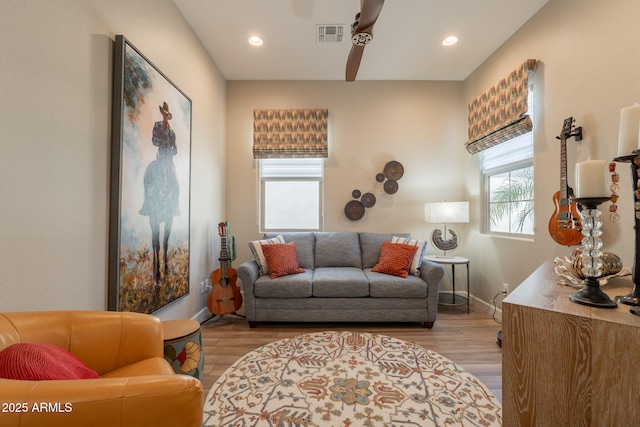 35756 N Clementine Trl, San Tan Valley, AZ 85140 - living room with wood finished floors, visible vents, a ceiling fan, and baseboards