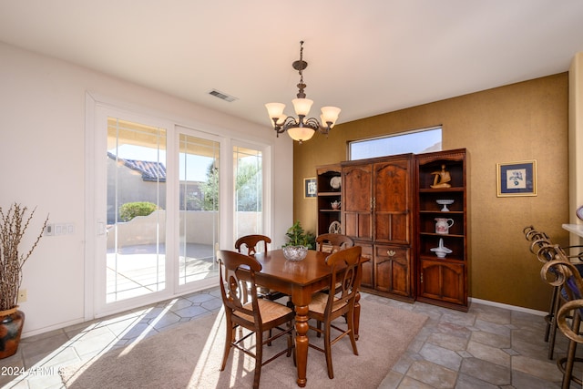 dining room featuring a notable chandelier