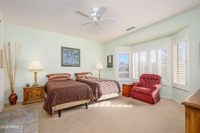 bedroom featuring ceiling fan and light colored carpet