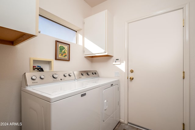 washroom with washer and dryer