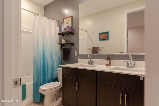 full bathroom featuring vanity, shower / tub combo, and toilet