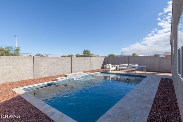 view of swimming pool with pool water feature, a patio, and an outdoor living space