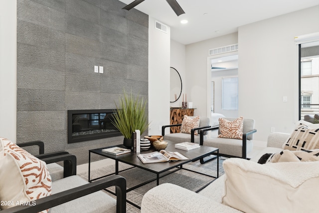 living room featuring a tile fireplace