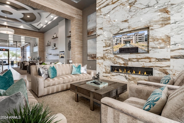 living room featuring a fireplace, a high ceiling, coffered ceiling, and beam ceiling