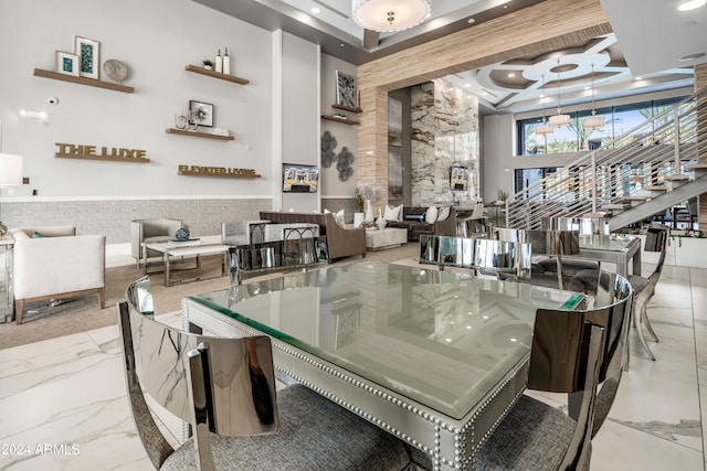 dining area with tile walls and a high ceiling