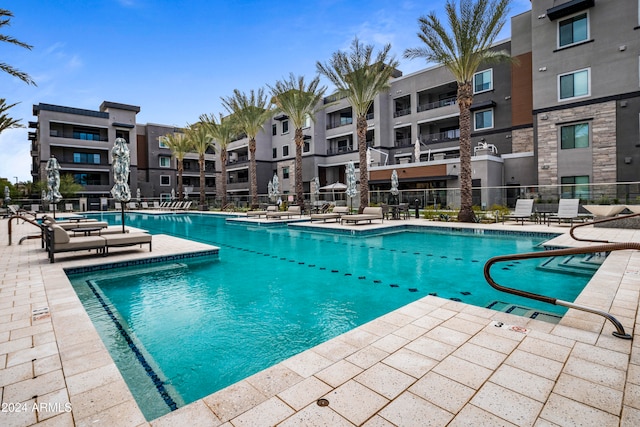 view of swimming pool featuring a patio