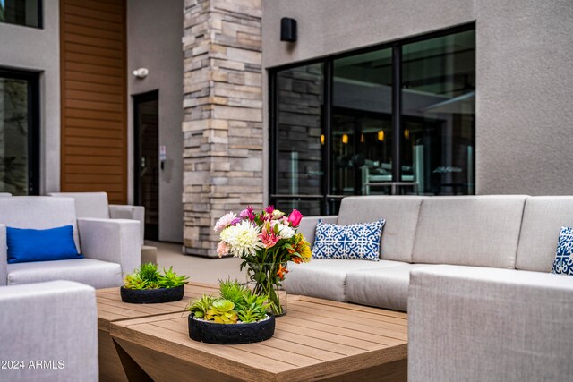 view of patio featuring outdoor lounge area and a wooden deck