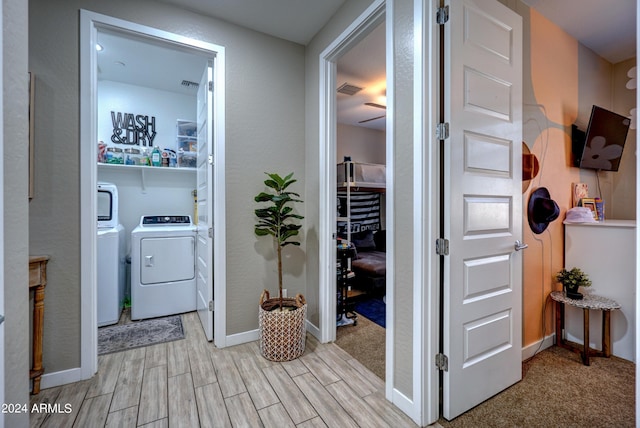 corridor featuring washer and dryer