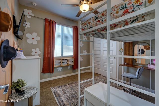 carpeted bedroom with ceiling fan and washer / dryer