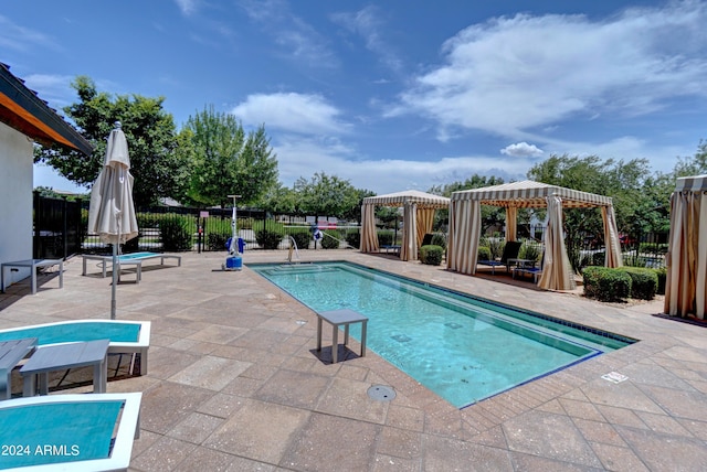 view of swimming pool featuring a gazebo and a patio