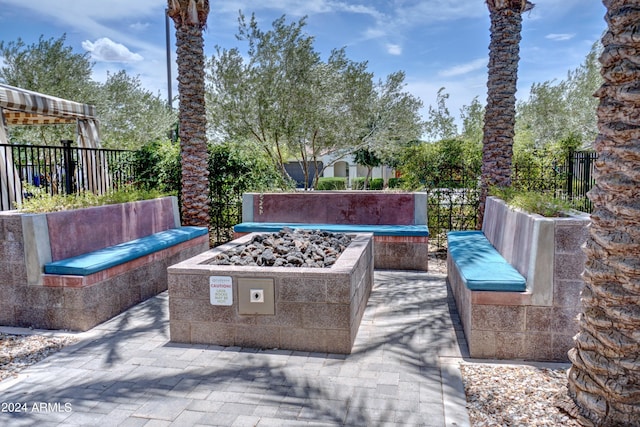 view of patio featuring an outdoor fire pit