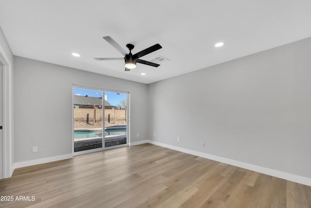 unfurnished room featuring light hardwood / wood-style floors and ceiling fan