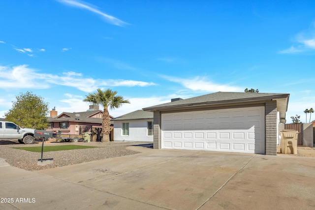 ranch-style home featuring a garage