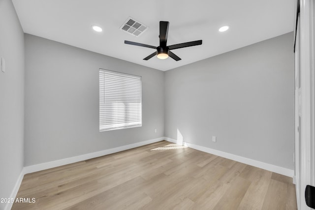 unfurnished room with ceiling fan and light hardwood / wood-style floors