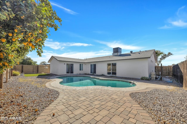 view of swimming pool featuring cooling unit and a patio area