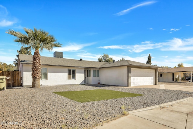 ranch-style home featuring a garage