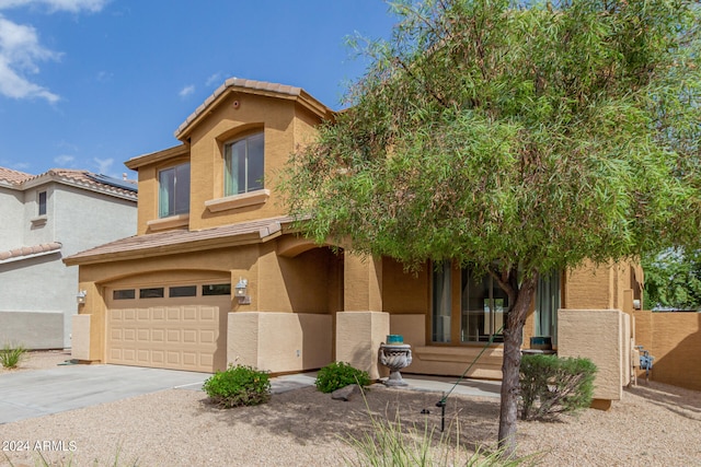 view of front of home with a garage