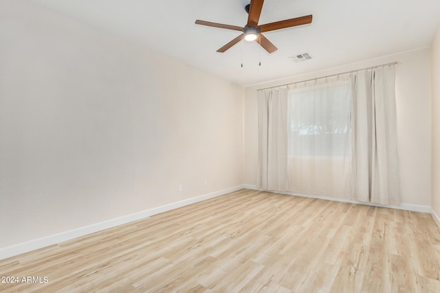 unfurnished room featuring ceiling fan and light hardwood / wood-style flooring