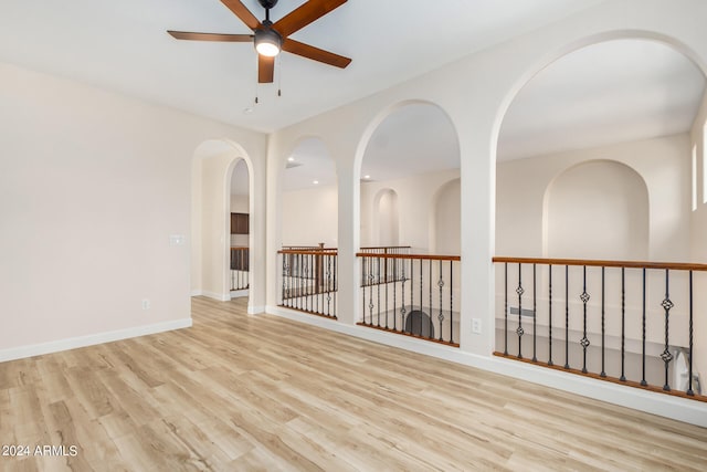 spare room featuring light wood-type flooring and ceiling fan