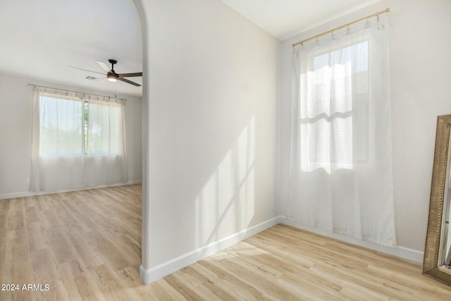 spare room with light hardwood / wood-style floors and ceiling fan