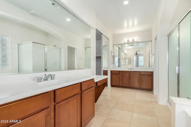 bathroom with vanity, tile patterned floors, and an enclosed shower