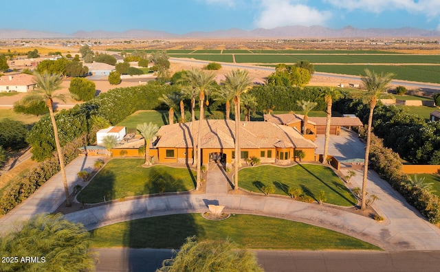 birds eye view of property with a mountain view