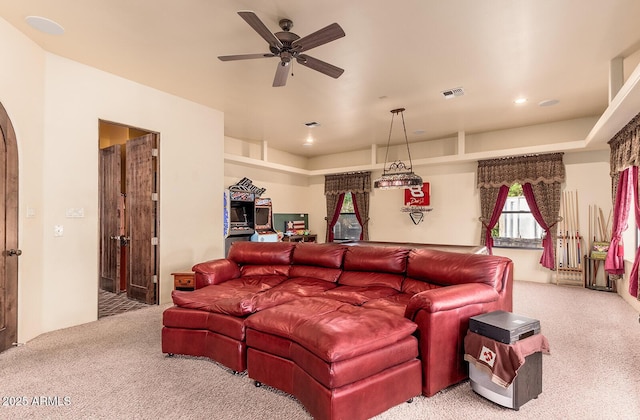 carpeted cinema with ceiling fan