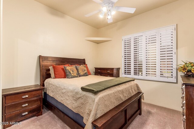 bedroom with ceiling fan and carpet flooring