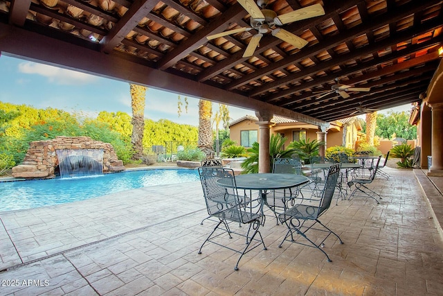 view of patio / terrace with ceiling fan and pool water feature