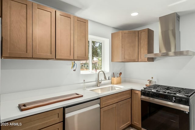 kitchen with a sink, recessed lighting, stainless steel appliances, wall chimney exhaust hood, and light countertops