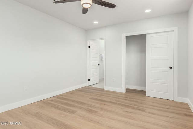 unfurnished bedroom featuring recessed lighting, light wood-type flooring, and baseboards