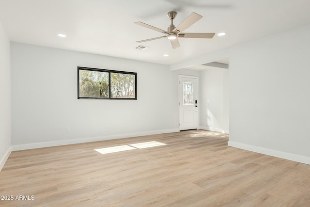 empty room featuring recessed lighting, visible vents, baseboards, and light wood finished floors