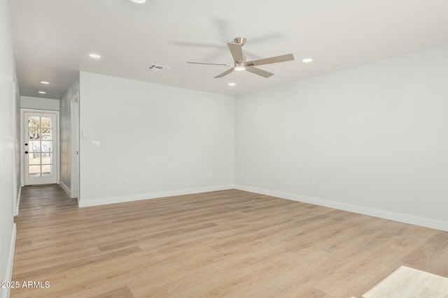 empty room with recessed lighting, visible vents, baseboards, and light wood-style floors