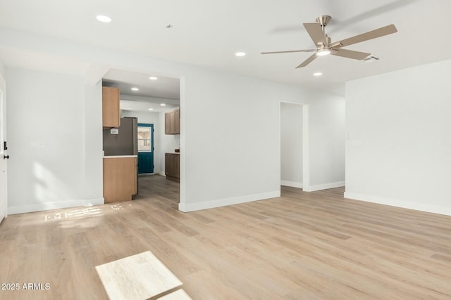 unfurnished living room featuring visible vents, recessed lighting, light wood-style floors, baseboards, and ceiling fan