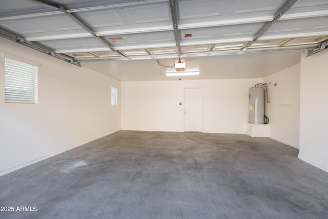 garage with water heater and a garage door opener