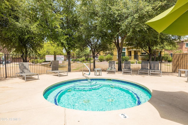 view of pool featuring a patio area and fence