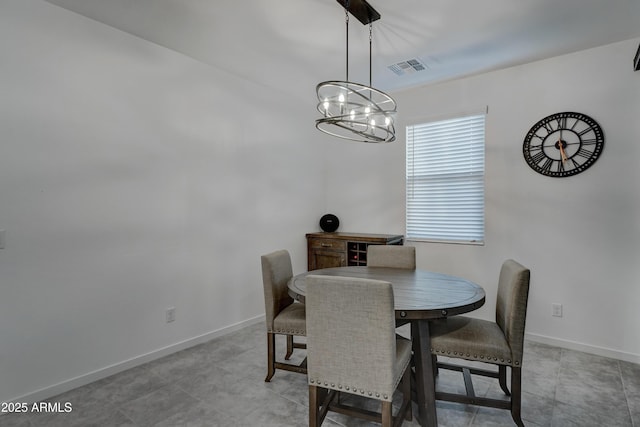 dining space featuring a chandelier