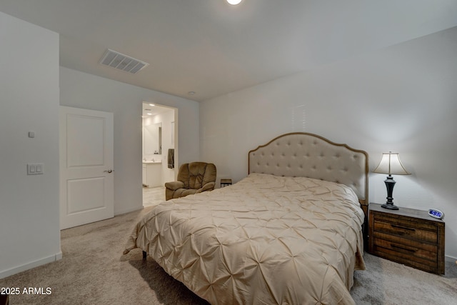 carpeted bedroom featuring connected bathroom