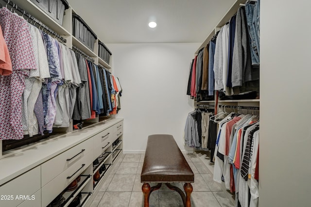 walk in closet featuring light tile patterned flooring