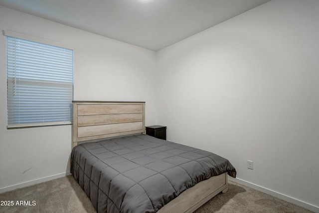 bedroom with light carpet