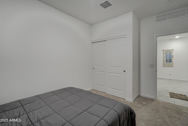 bedroom with a closet and carpet