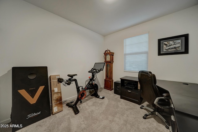 home office with light carpet and vaulted ceiling