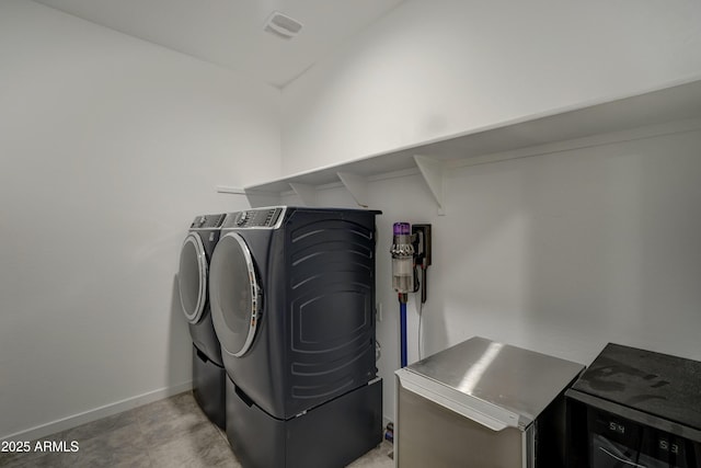 laundry room featuring washing machine and dryer