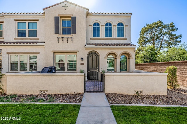 4077 S Sabrina Dr Unit 14, Chandler, AZ 85248 - mediterranean / spanish home with a fenced front yard, stucco siding, a tile roof, and a gate