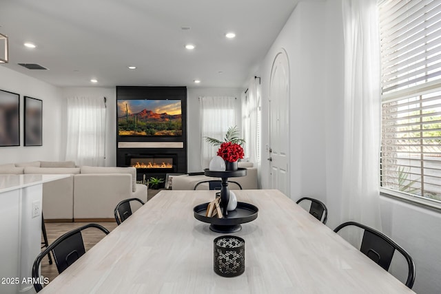 4077 S Sabrina Dr Unit 14, Chandler, AZ 85248 - dining space with visible vents, recessed lighting, and a glass covered fireplace