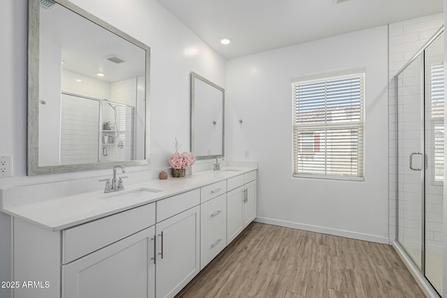 4077 S Sabrina Dr Unit 14, Chandler, AZ 85248 - bathroom with a sink, visible vents, a stall shower, and wood finished floors